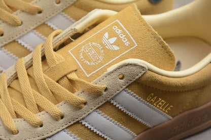 Gazelle amarelo, branco e azul-marinho