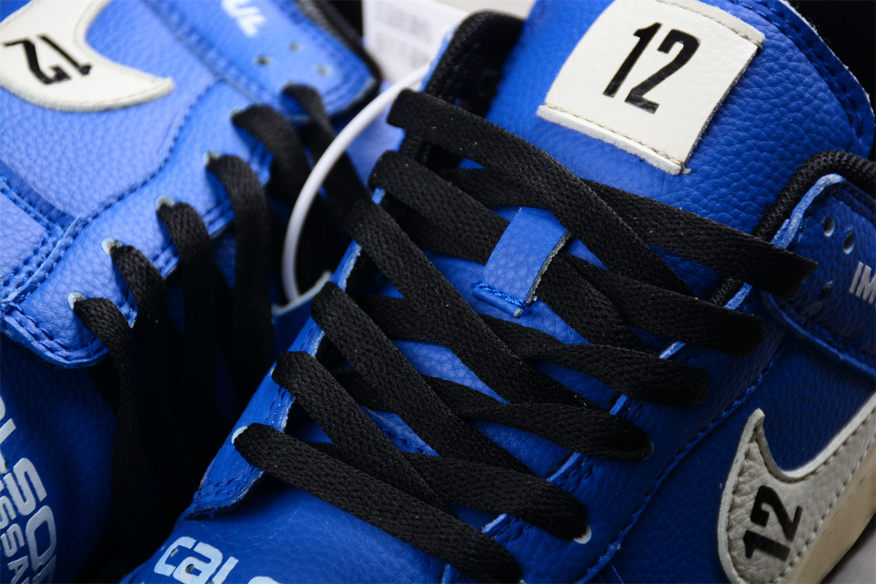 Dunk Low “Calsonic Nissan Impul” azul e branco