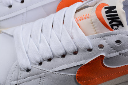 Blazer Low ’77 branco e laranja